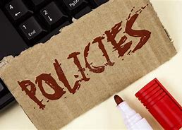 Policies sign with pen on a desk